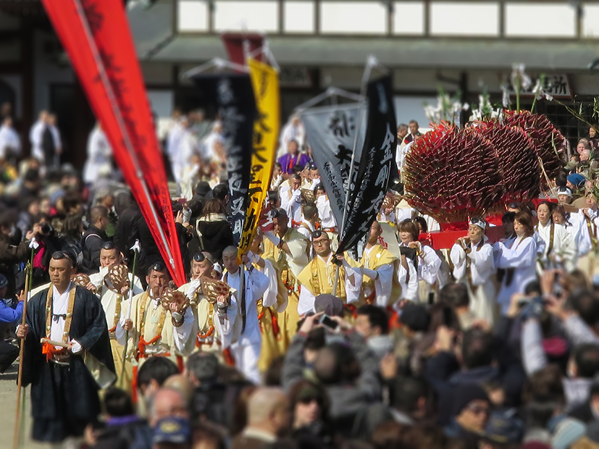 At 1:00, the participants form a procession that visits the small nearby shrine with much blowing of conch shells, before filing into the sacred bonfire area. Before torching of the mountain of cedar boughs, various ceremonies must be observed: the striking of the flint, the firing of arrows in all four directions, martial arts-like katas with a long-handled axe and a sword, the reading of rather lengthy sutras, and, of course, the recitation of the names of worthy donors (a lot of them).
