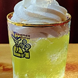 Japanese soda topped with soft serve ice cream pineapple flavor